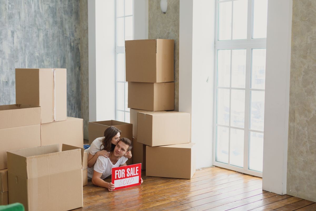 Young couple very happy and excited about moving into new apartment Young couple very happy and excited about moving into new apartment